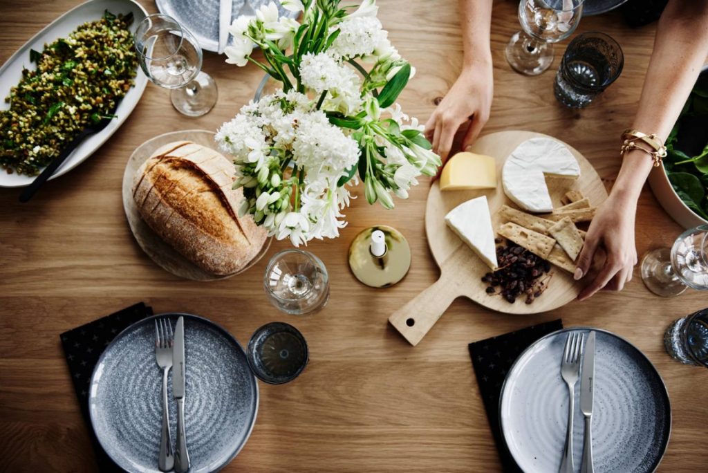 Table of food with cheese platter and sourdough