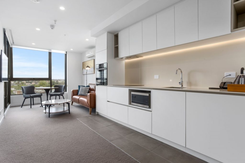 Kitchen and dining at The Sebel Moonee Ponds in 1 bedroom apartment with queen bed